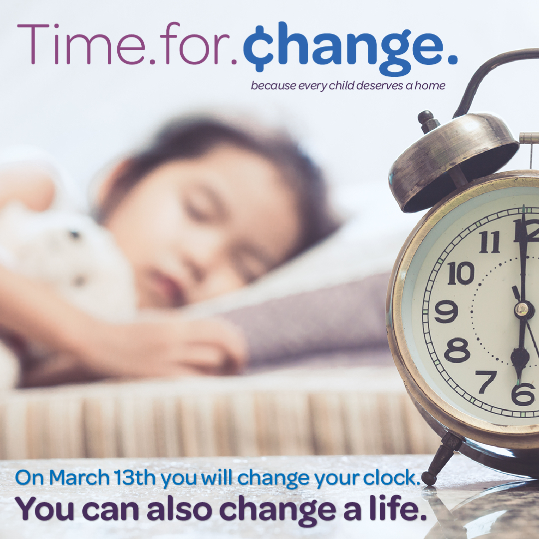 Young girl sleeping behind alarm clock