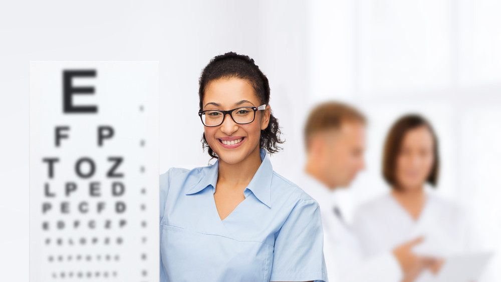 School nurse with eye chart