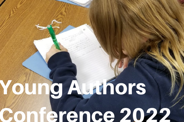 Student writing in a notebook. Young Authors Conference 2022.