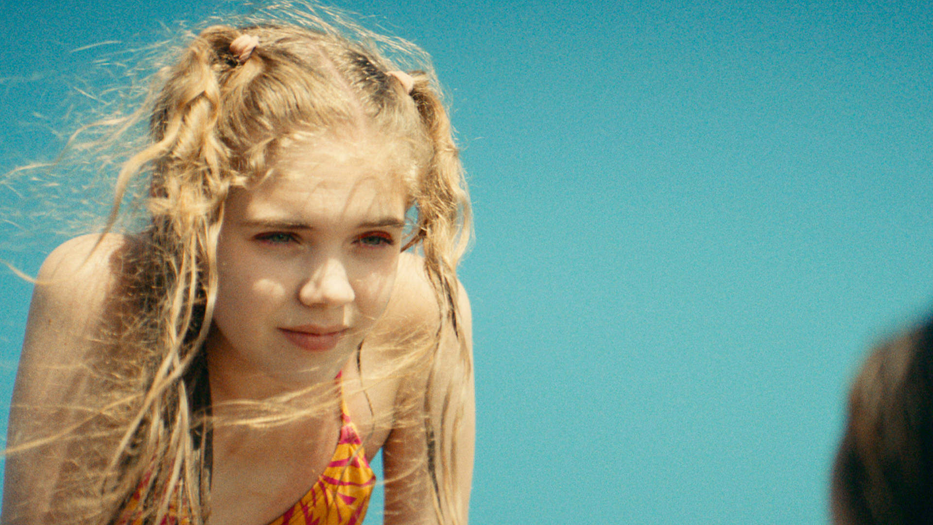 three smiling girls in a car from the short film cupids