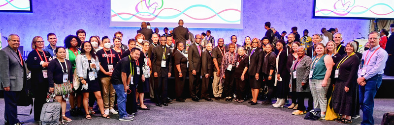 picture of group of delegate in main hall of WCC Assembly